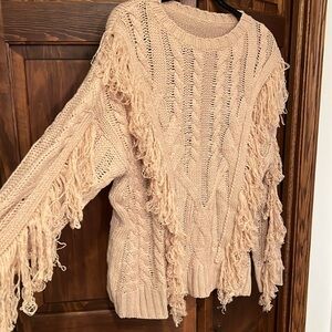 Fringed cable knit sweater